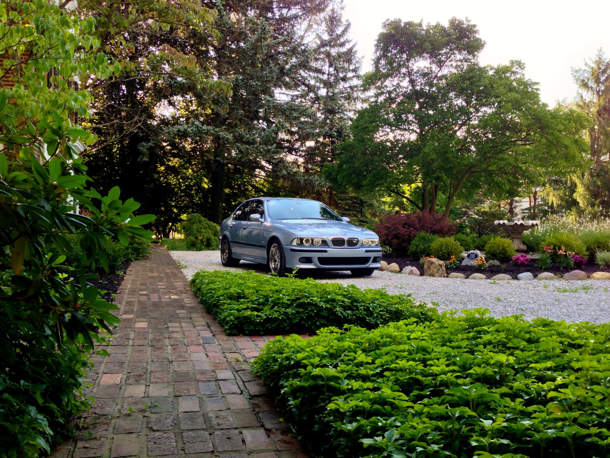 BMW E39 Parked Next to the Construction Site of an Apartment Building ·  Free Stock Photo